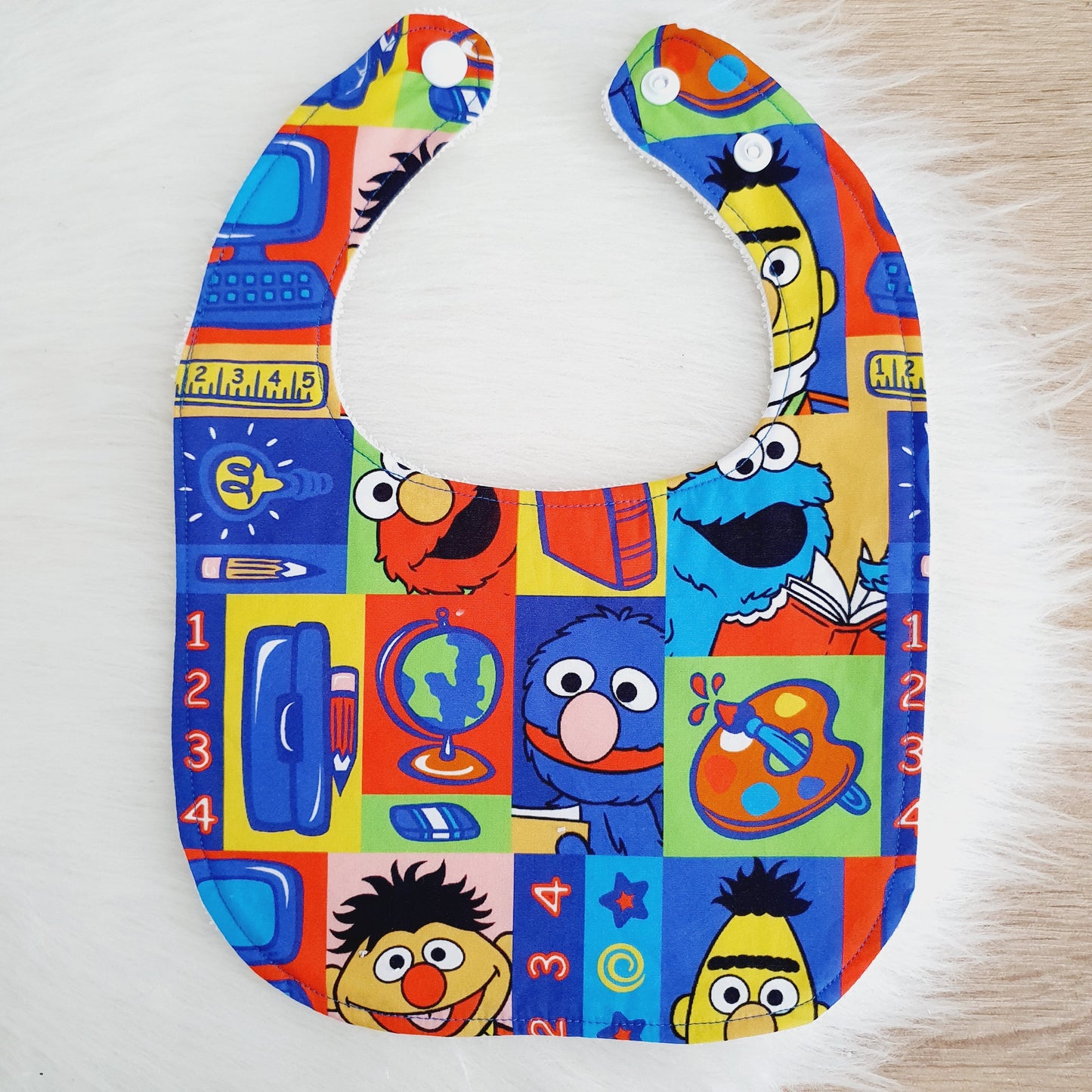 SESAME ST print Small Feeding Bib - Organic Bamboo Backed, Ultra Absorbent Bib